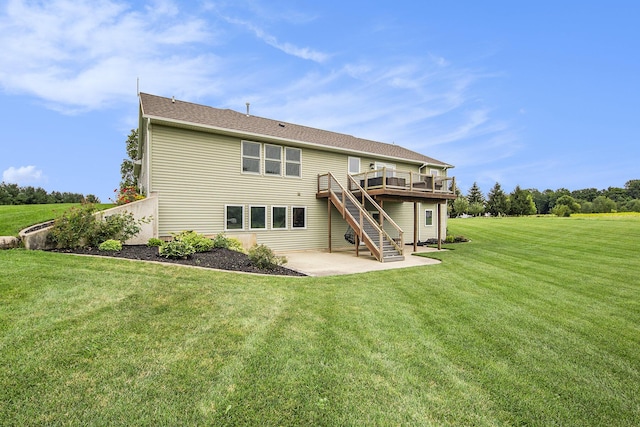 back of house with a patio area, stairway, a lawn, and a wooden deck