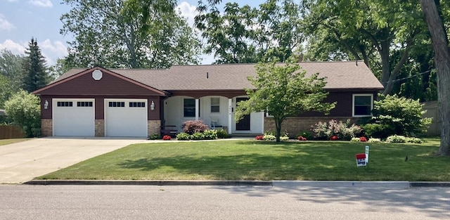 view of front of house with a garage and a front yard