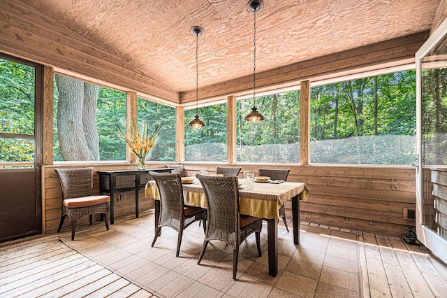 sunroom / solarium featuring vaulted ceiling and wooden ceiling