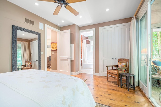 bedroom with access to exterior, ceiling fan, connected bathroom, and light hardwood / wood-style flooring