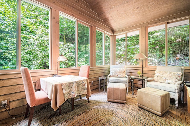 sunroom / solarium featuring wood ceiling and vaulted ceiling