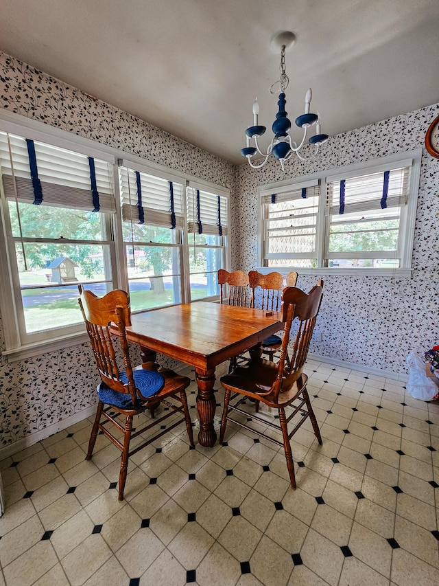 dining space featuring a notable chandelier