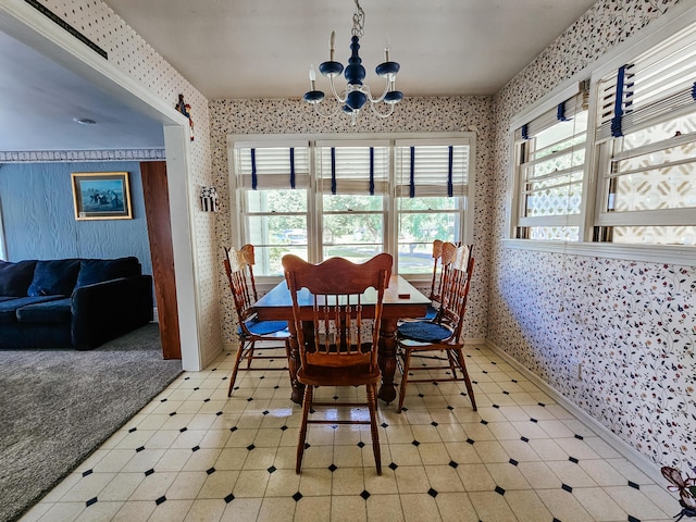 dining space with an inviting chandelier