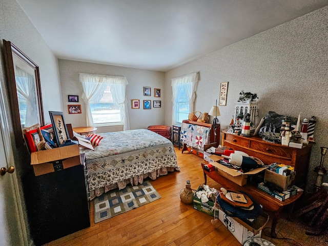 bedroom with hardwood / wood-style floors