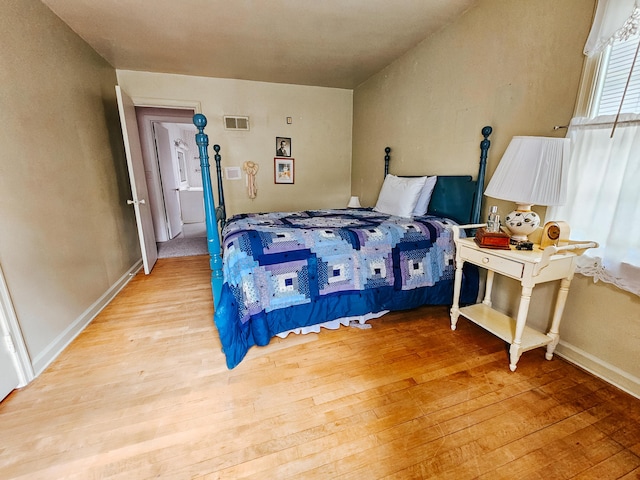 bedroom with light wood-type flooring