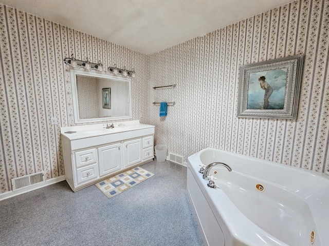 bathroom featuring vanity and a tub