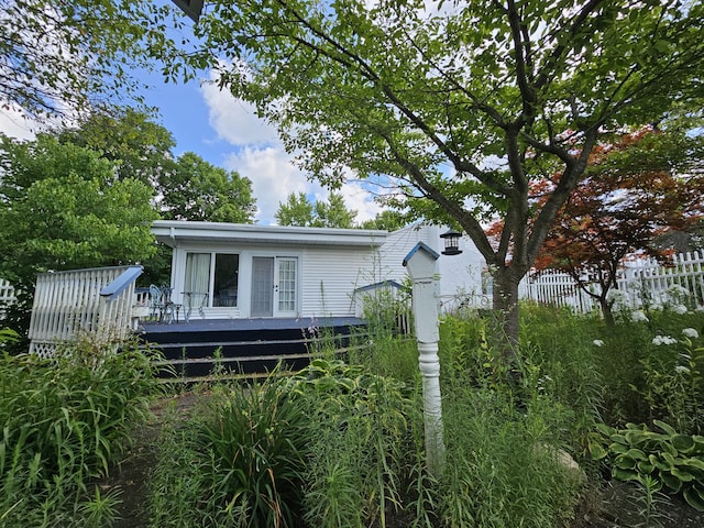 exterior space featuring a wooden deck