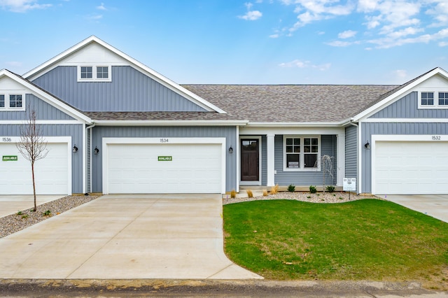 view of front facade with a front lawn and a garage