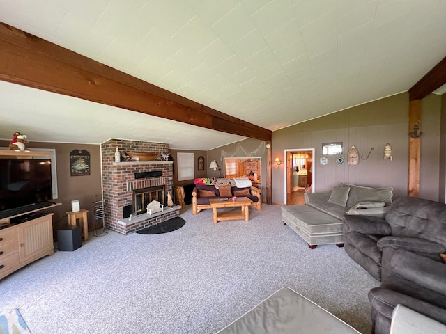 carpeted living room with vaulted ceiling with beams and a fireplace