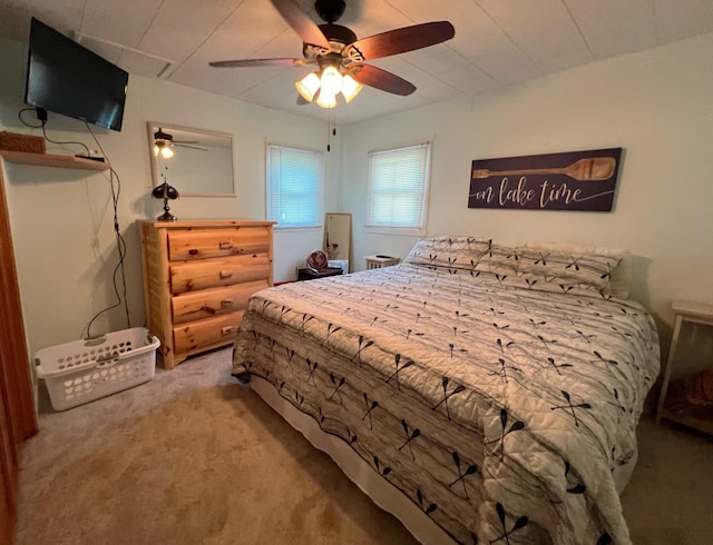 bedroom with ceiling fan and carpet