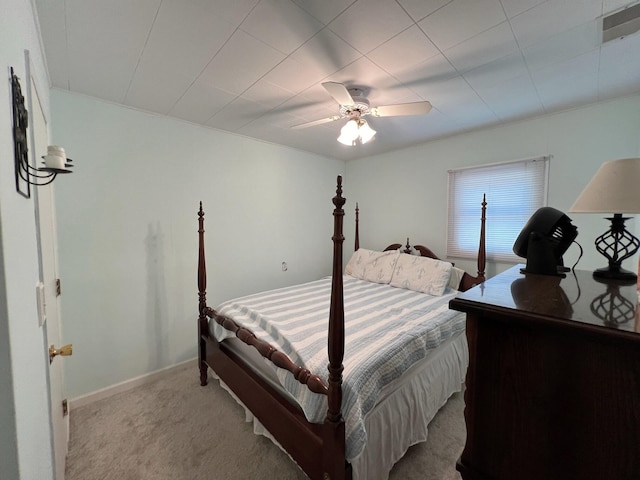 bedroom featuring light colored carpet and ceiling fan