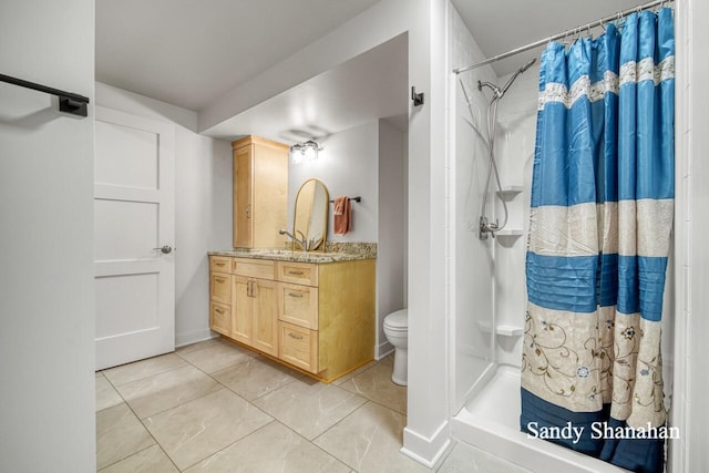 bathroom with vanity, a shower with curtain, tile patterned floors, and toilet