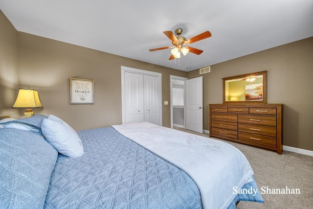 carpeted bedroom featuring ceiling fan and a closet