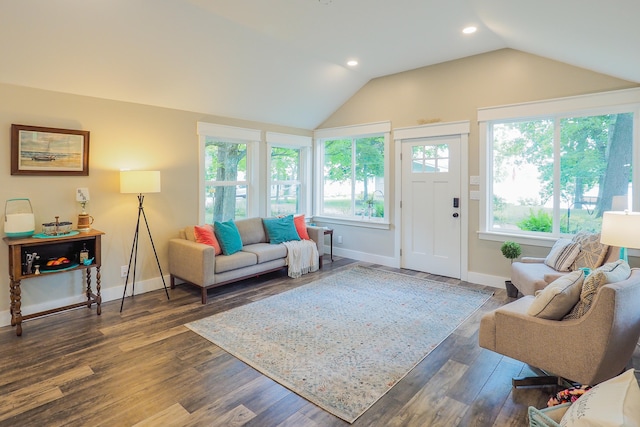 living room featuring dark hardwood / wood-style floors and vaulted ceiling