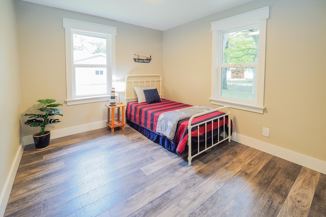 bedroom with wood-type flooring