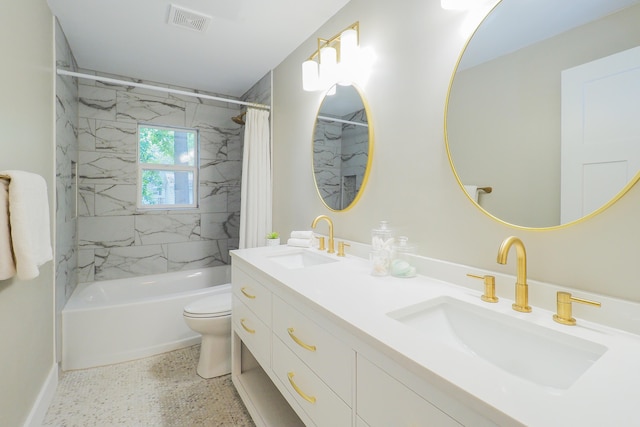 full bathroom featuring shower / bath combo, toilet, and double sink vanity