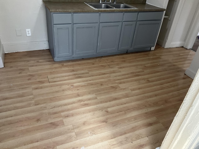 room details featuring wood-type flooring and sink