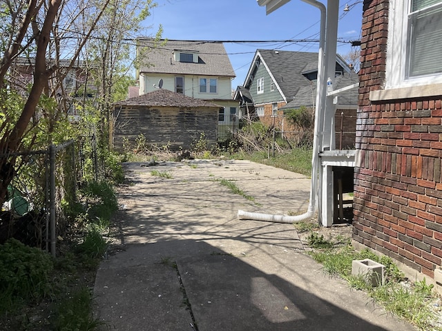 view of gate with a patio area