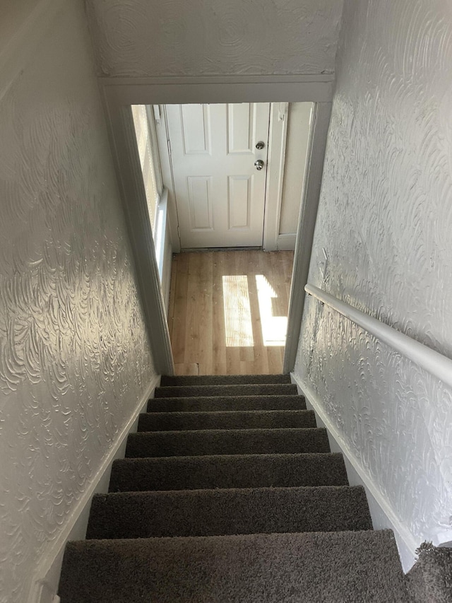 stairway with wood-type flooring