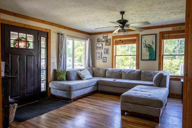 living room with hardwood / wood-style floors and ceiling fan