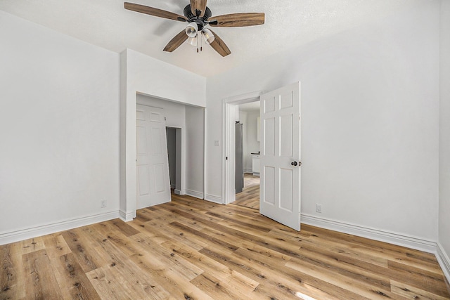 unfurnished bedroom with light hardwood / wood-style floors and ceiling fan