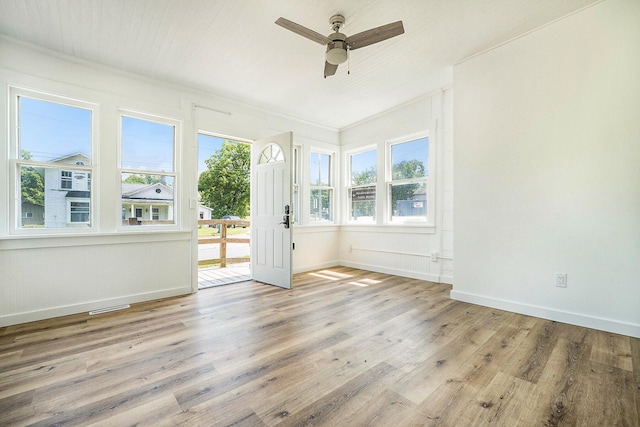 interior space featuring crown molding, ceiling fan, and light hardwood / wood-style flooring