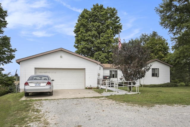 ranch-style home with an attached garage, gravel driveway, and a front lawn