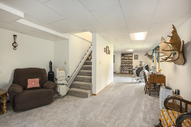 interior space with carpet flooring, stairway, a paneled ceiling, and baseboards
