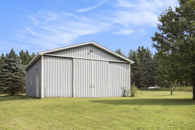 view of pole building with a lawn
