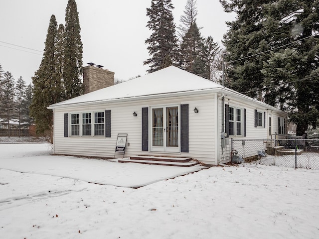 view of snow covered house