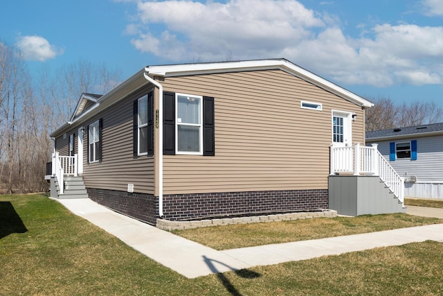 view of home's exterior featuring a yard