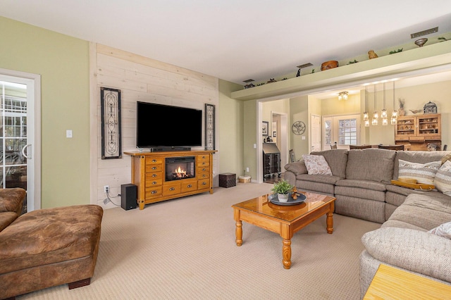 carpeted living room featuring french doors