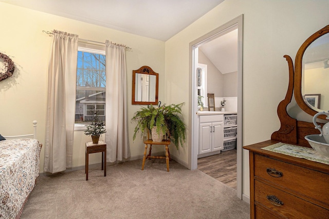 interior space featuring lofted ceiling and light colored carpet