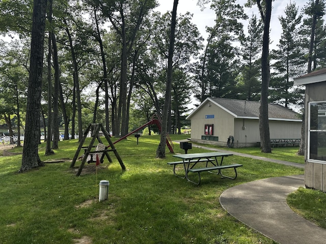 view of home's community with a lawn