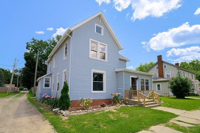 view of property featuring a front yard