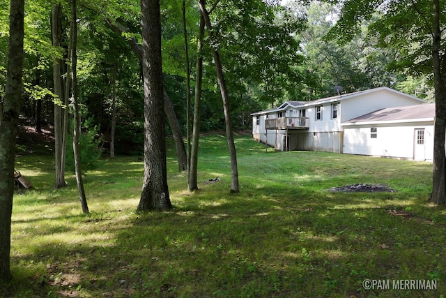 view of yard with a deck