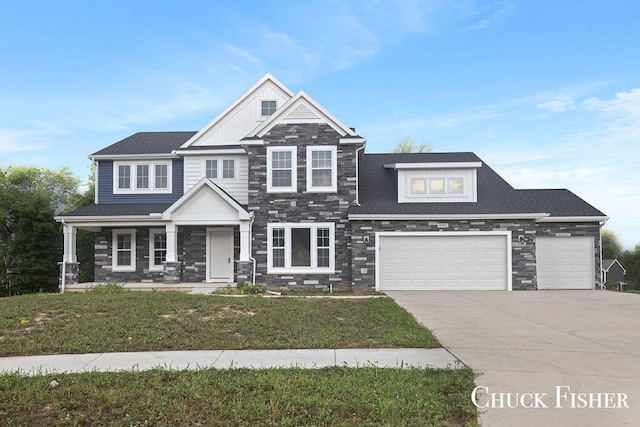 view of front of property with a porch, a garage, and a front yard