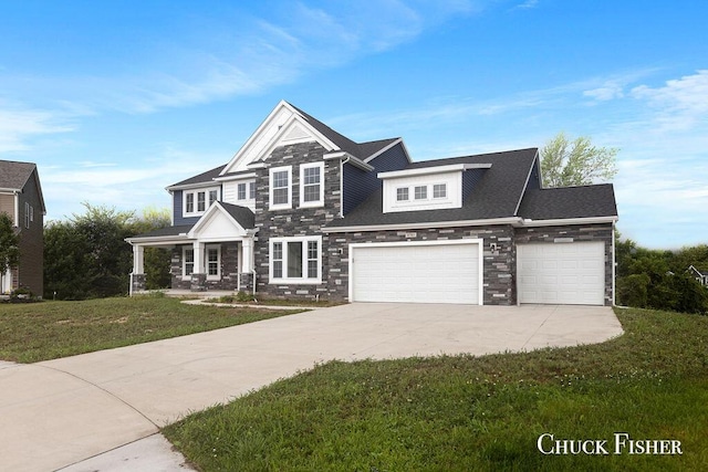 view of front facade with stone siding, a front yard, concrete driveway, and an attached garage