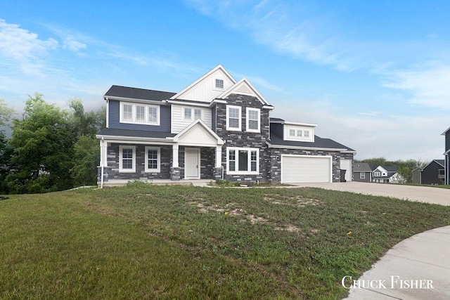 craftsman-style home featuring concrete driveway and a front lawn