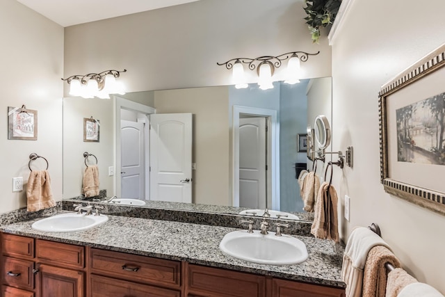 bathroom with double vanity and a sink