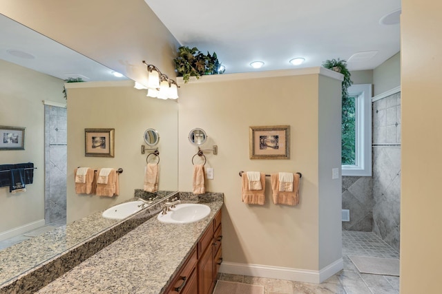 bathroom with vanity, a walk in shower, and baseboards