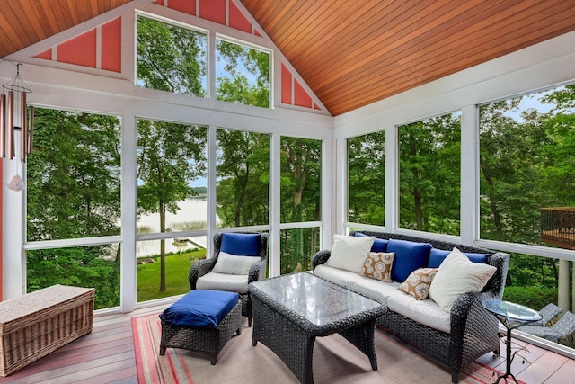 sunroom featuring lofted ceiling and wood ceiling