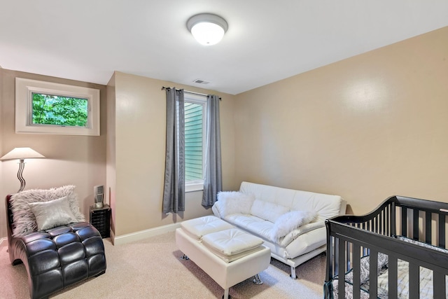 carpeted bedroom with visible vents and baseboards