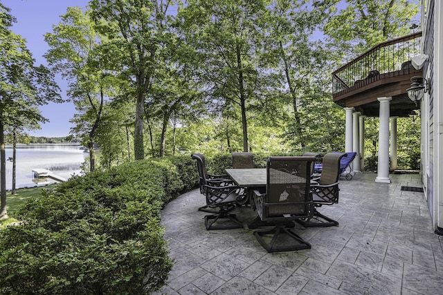 view of patio / terrace featuring outdoor dining space and a water view