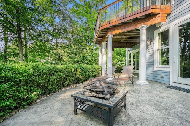 view of patio / terrace featuring an outdoor fire pit