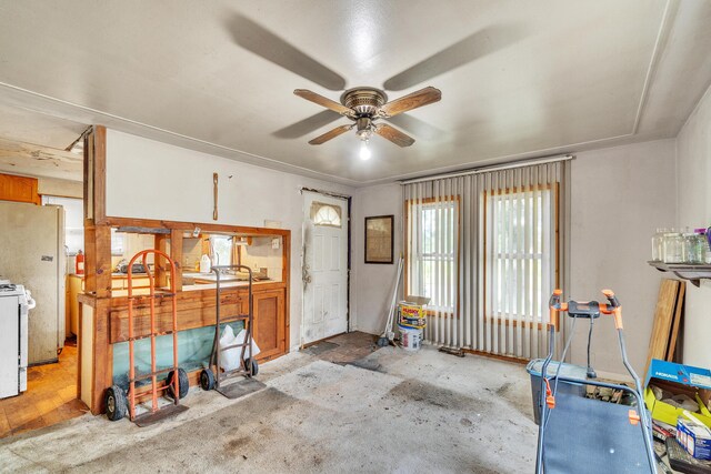 misc room featuring light colored carpet and ceiling fan