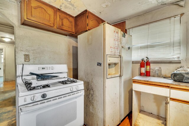 kitchen featuring white appliances and tile countertops