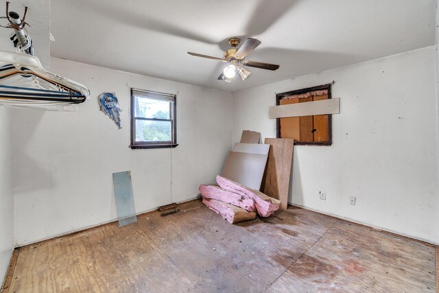 interior space featuring ceiling fan