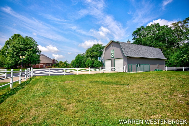 view of yard with an outbuilding and a garage