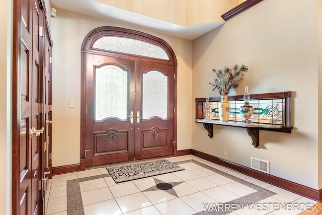 foyer featuring light tile patterned floors